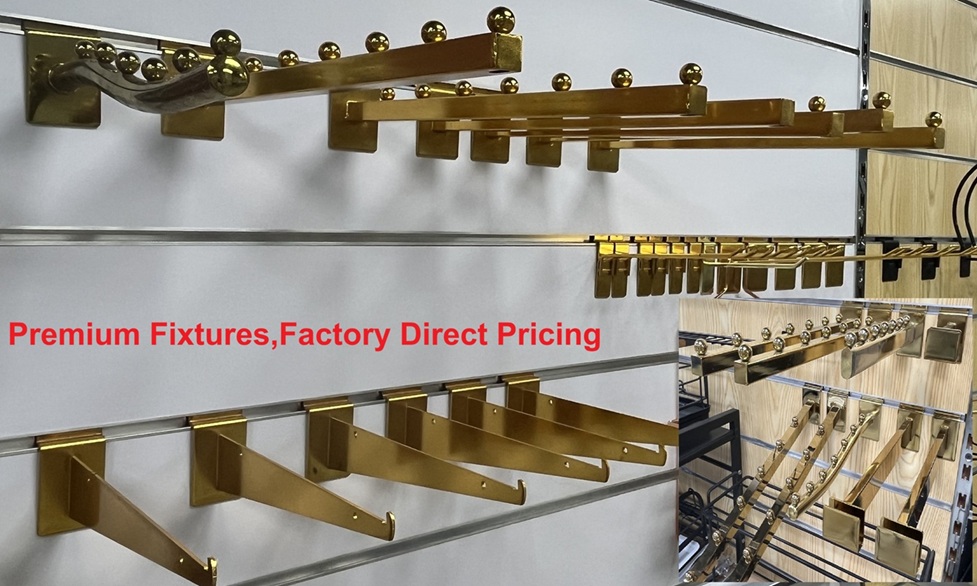 A variety of retail display hooks and brackets, including gold, chrome, and black finishes, neatly arranged on a white slatwall panel.+++ A variety of retail display hooks and brackets, including gold, chrome, and black finishes, neatly arranged on a white slatwall panel.+++
