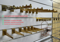 //ilrorwxhopmmli5m.ldycdn.com/cloud/pkBpjKkkloSRplrkimopkp/Luxury-Gold-Slatwall-Hooks-Direct-Factory-OEM.jpg
